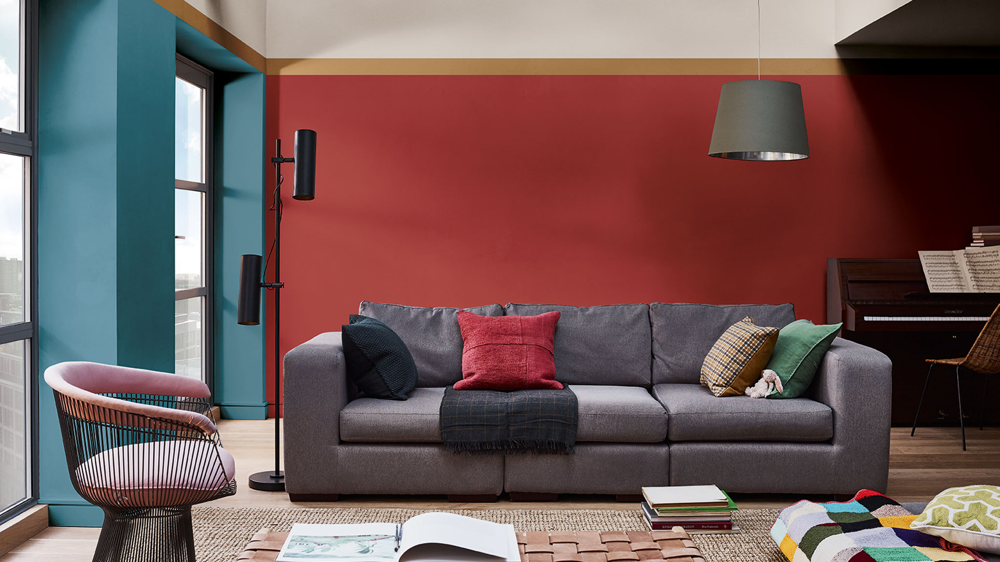 A living room in deep reds and rich teals